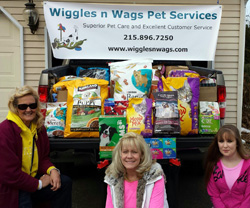 Wiggles n Wags Pet Services Team with Pet Food Donation